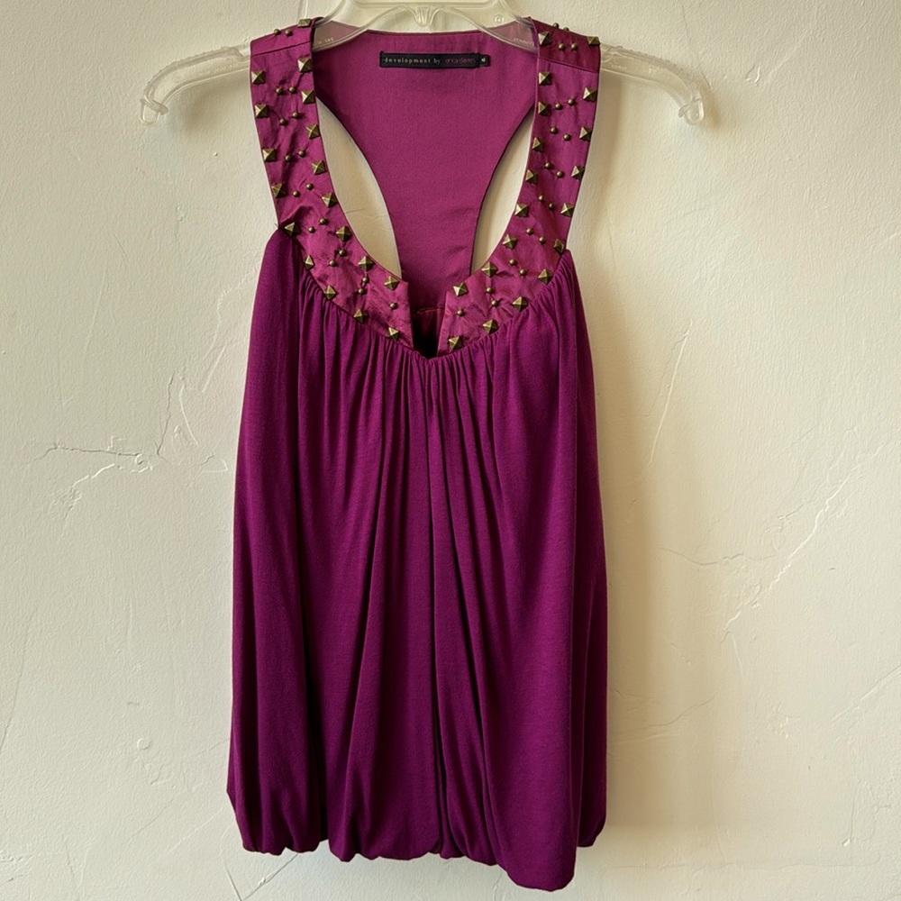 Racerback sleeveless top with a gold studded neckline. Size 6